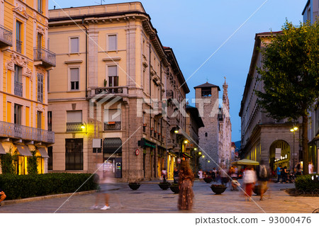 Streets and buildings of Como city in evening near mountains in Italy 93000476
