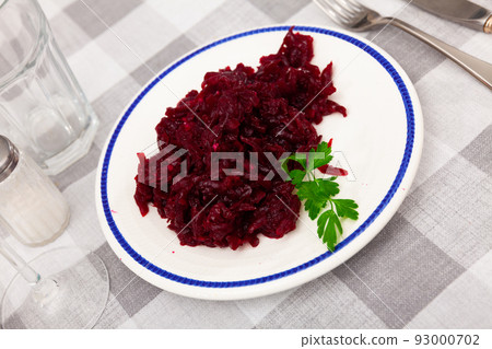 Popular russian salad, made from boiled grated beetroot, decorated with herbs Popular russian salad, made from boiled grated beetroot, decorated with herbs 93000702