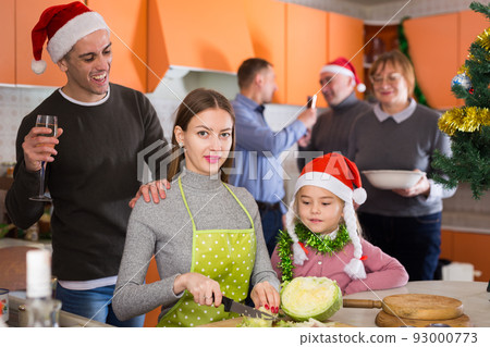 Woman with kid girl preparing family dinner Woman with kid girl preparing family dinner 93000773
