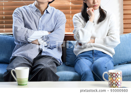 A couple thinking (fighting) in the living room A couple thinking (fighting) in the living room 93000980