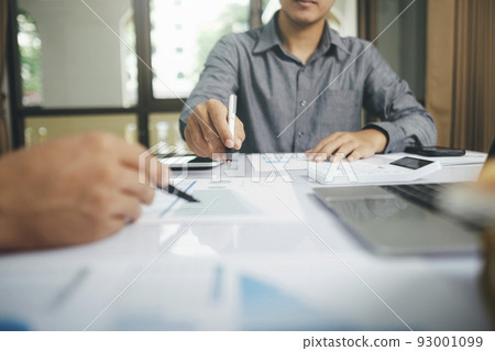 Close up asisan businessman teamwork meeting and discussing the investment data and report graph. Close up asisan businessman teamwork meeting and discussing the investment data and report graph. 93001099