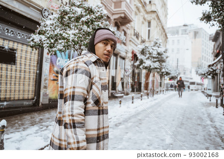 asian man walking in historical old town in istanbul 93002168