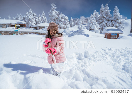 happy girl playing outside in the snow happy girl playing outside in the snow 93002457