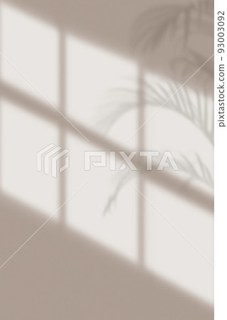 Sunlight shining through the window hits the concrete gray wall inside the room, vertical view. Sunlight shining through the window hits the concrete gray wall inside the room, vertical view. 93003092