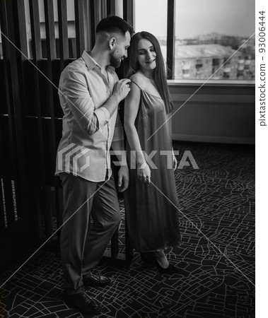 European young couple at hotel room 93006444