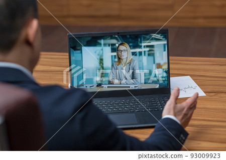 Male asian boss talking on video call with colleagues, online rally video call, boss working in classic office 93009923