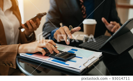 business team accountant use Laptop and calculator to calculate the company's financial on data network of finance and banking with business growth business team accountant use Laptop and calculator to calculate the company's financial on data network of finance and banking with business growth 93014711