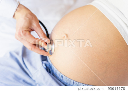Doctor stethoscope patient pregnancy woman. Medical clinic for pregnant consultant. Doctor examining pregnancy woman belly holding stethoscope. Concept maternity, pregnancy, childbirth. Doctor stethoscope patient pregnancy woman. Medical clinic for pregnant consultant. Doctor examining pregnancy woman belly holding stethoscope. Concept maternity, pregnancy, childbirth. 93015678