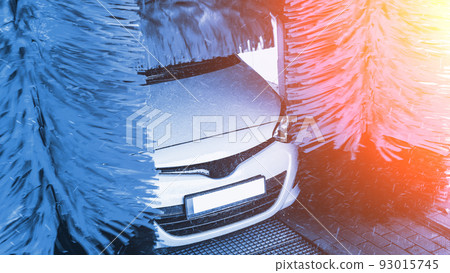 Automatic car wash. Auto brush washer clean blue car on automatic carwash station. Automatic car wash cleaning service. 93015745