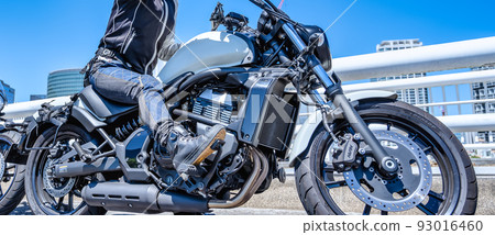 Image cut of a female rider touring Yokohama on a large American motorcycle Image cut of a female rider touring Yokohama on a large American motorcycle 93016460