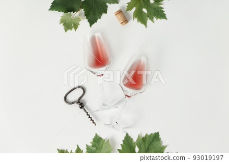 Rose wine in glasses. Flat-lay of wine glasses with rose wine on white background Rose wine in glasses. Flat-lay of wine glasses with rose wine on white background 93019197