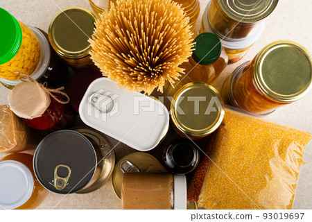 Emergency survival food set on white kitchen table high angle view Emergency survival food set on white kitchen table high angle view 93019697