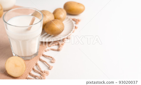 A glass of potato milk on the table. Alternative Plant-Based Milk 93020037