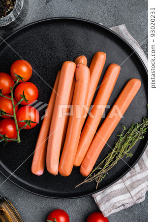 Raw sausage, on gray stone table background, top view flat lay Raw sausage, on gray stone table background, top view flat lay 93020231