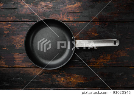 Empty skillet, frying pan with copy space for text or food with copy space for text or food, top view flat lay , on old dark  wooden table background 93020545