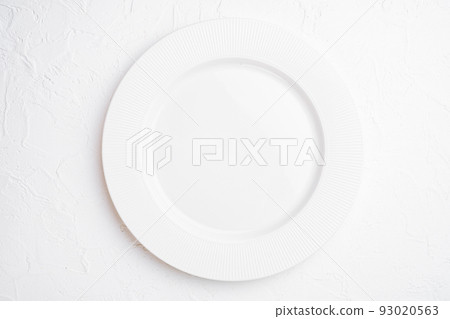 Empty white plate porcelain with copy space for text or food with copy space for text or food, top view flat lay , on white stone table background 93020563