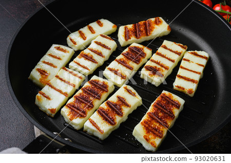 Halloumi fried cheese, on old dark rustic table background 93020631