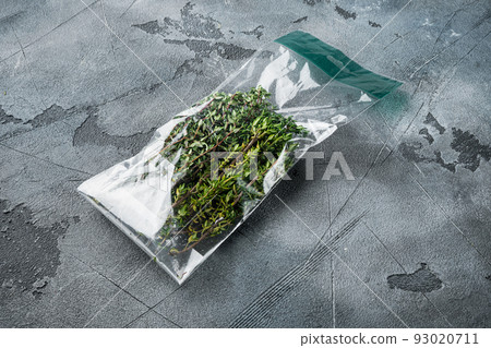 Thyme in plastic bag, on gray background 93020711