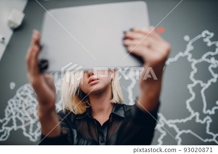 Young woman using digital tablet indoor. Social media and using technology concept. 93020871