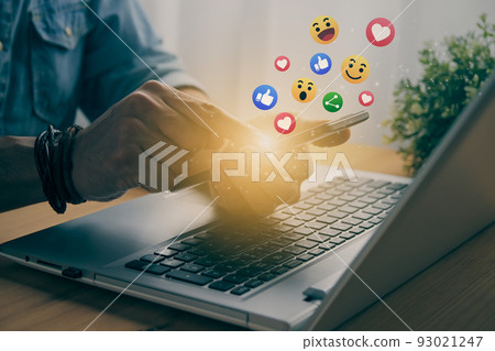 Casual Businessman Touching Mobile Phone Screen and Social Media Emoticon in Vintage Tone Casual Businessman Touching Mobile Phone Screen and Social Media Emoticon in Vintage Tone 93021247