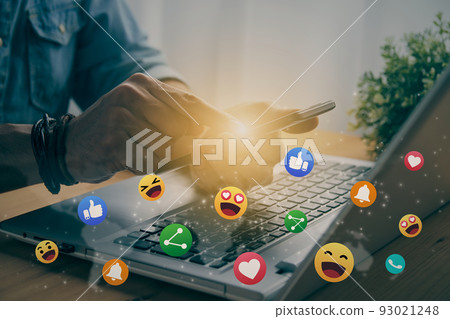 Casual Businessman Touching Mobile Phone Screen and Bottom Social Media Emoticon in Vintage Tone 93021248