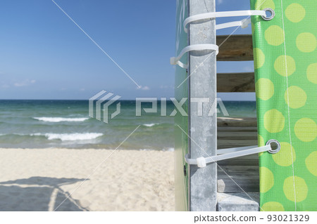 Beach umbrella against the blue clear sky on the beach 93021329