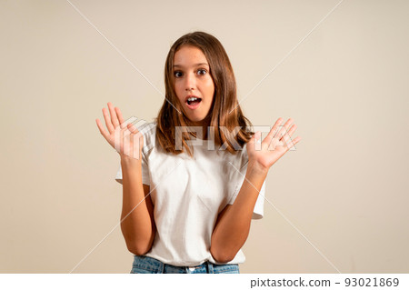 Happy shocked excited surprised child girl holding empty open hands.Childhood lifestyle concept. Mock up copy space Happy shocked excited surprised child girl holding empty open hands.Childhood lifestyle concept. Mock up copy space 93021869