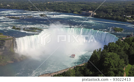 Aerial view of Horseshoe Falls including Hornblower Boat sailing on Niagara River, Canada and USA natural border 93022413