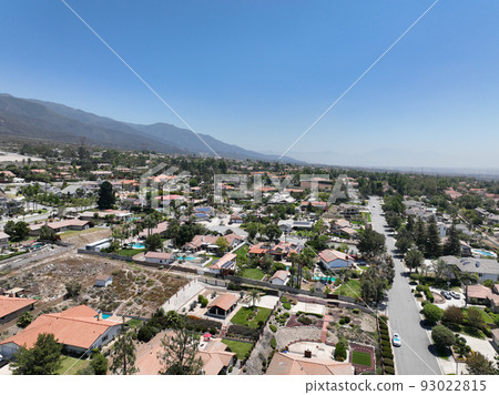 Aerial view of wealthy Alta Loma community and mountain range. Aerial view of wealthy Alta Loma community and mountain range. 93022815