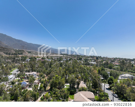 Aerial view of wealthy Alta Loma community and mountain range. Aerial view of wealthy Alta Loma community and mountain range. 93022816