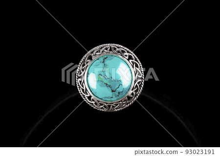 Silver ring with turquoise stone on black background 93023191