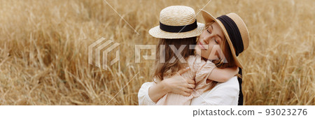 Banner mom and daughter in a wheat field 93023276