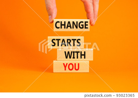 Change starts with you symbol. Concept words Change starts with you on wooden blocks on beautiful orange table orange background. Businessman hand. Business motivational change starts with you concept Change starts with you symbol. Concept words Change starts with you on wooden blocks on beautiful orange table orange background. Businessman hand. Business motivational change starts with you concept 93023365