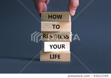 Restress your life symbol. Concept words How to restress your life on wooden blocks. Doctor hand. Beautiful grey background. Psychological business and restress your life concept. Copy space. 93023399
