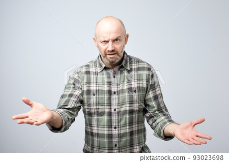 Mture european man dissatisfied frowns and looks sullenly. What do you mean concept. Will you return me my money. Mture european man dissatisfied frowns and looks sullenly. What do you mean concept. Will you return me my money. 93023698