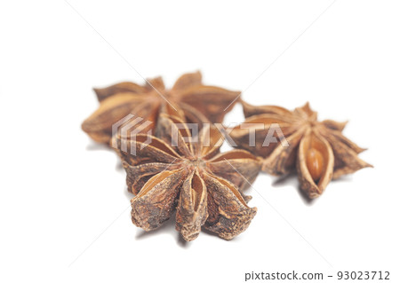 A group of star anises isolated on white background. Dried star anise spice fruits top view. A group of star anises isolated on white background. Dried star anise spice fruits top view. 93023712