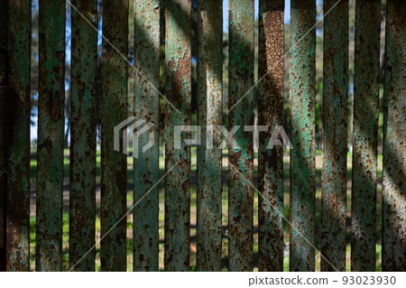Rusty metal green fence. Background and copyspace. 93023930