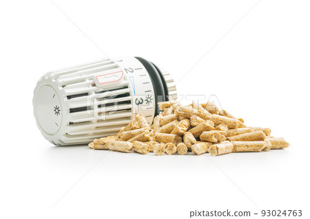 Wooden pellets and thermostatic valve head isolated on white background. Biomass Wooden pellets and thermostatic valve head isolated on white background. Biomass 93024763