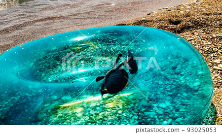 Blue inflatable swim ring float and sunglasses on the beach. Blue inflatable swim ring float and sunglasses on the beach. 93025053