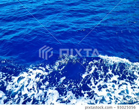 Deep blue surface of transparent sea water with sun glints Deep blue surface of transparent sea water with sun glints 93025056