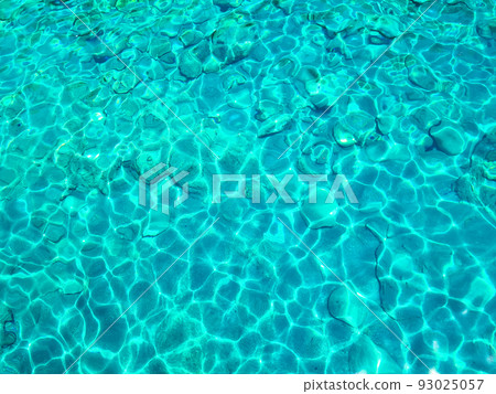 Turquoise surface of transparent sea water with sun glints Turquoise surface of transparent sea water with sun glints 93025057