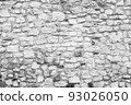 Black and white stone wall for background design. Vintage of stone backdrop. Natural stone wall textured background for a poster, calendar, screensaver, wallpaper, postcard, banner, cover, website 93026050