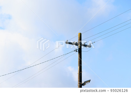telephone pole and blue sky 93026126
