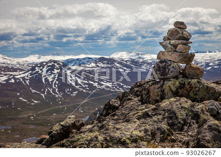 Inukshuk, Stacked stones above jotunheimen mountains in Norway Inukshuk, Stacked stones above jotunheimen mountains in Norway 93026267