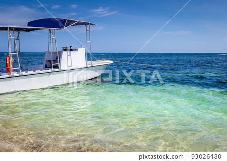 Idyllic caribbean beach with motorboat, Negril Seven Mile Beach, Jamaica Idyllic caribbean beach with motorboat, Negril Seven Mile Beach, Jamaica 93026480