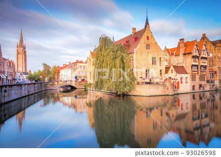 Rozenhoedkaai canal reflection at sunrise and blurred clouds, Bruges 93026598
