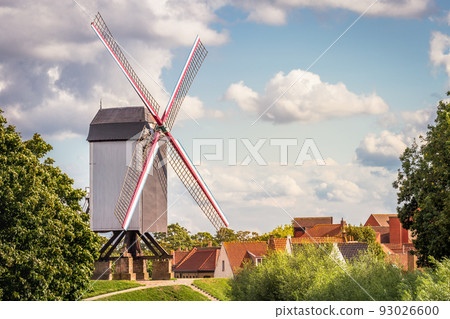 Rustic wooden windmills in idyllic Bruges public park, Belgium 93026600