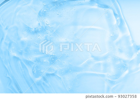 Cream gel blue transparent cosmetic sample with bubbles isolated on white background. Face serum texture. Clear skincare product smudge closeup. Hand sanitizer 93027358
