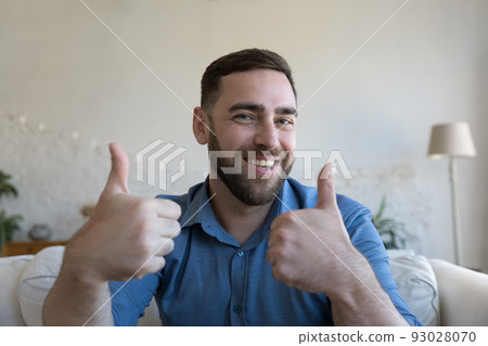 Cheerful happy adult 30s guy showing like thumb up hands 93028070