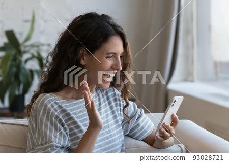 Cheerful pretty Latin blogger woman talking on mobile phone Cheerful pretty Latin blogger woman talking on mobile phone 93028721